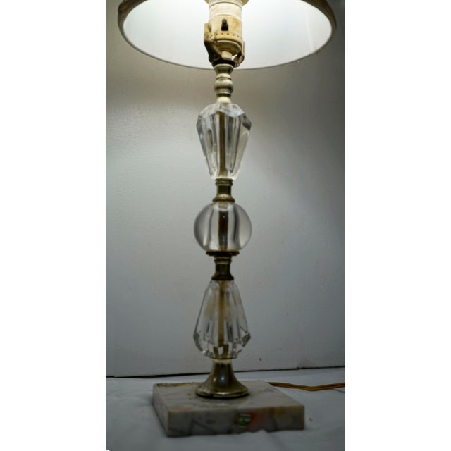 This is an elegant vintage lamp that belongs in a living or bedroom area. The marble base still shows the label of the...