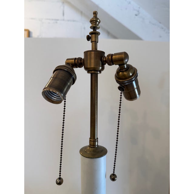 For your consideration a handsome pair of vintage mahogany Regency style candlestick lamps. These rest on small brass ball...