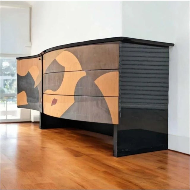 Bring timeless design into your home with this Postmodern Italian sideboard in a striking black lacquer and wood inlay...