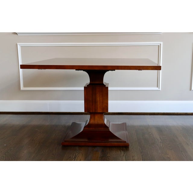 This 42- inch square Cherry table for Baker Furniture is exquisite. Perfect addition to any room. It has a warm cherry...