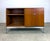 A beautiful, modestly-sized credenza cabinet by Florence Knoll for Knoll Furniture circa 1960’s. Features teak veneer, a...