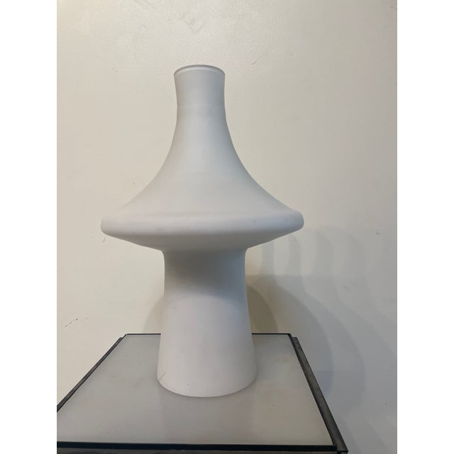 Striking, simple, and inventive- this hand-blown frosted glass lamp adds a lovely warm glow to any room. Scandinavian...
