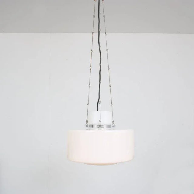 A lovely hanging lamp, designed by Herbert Proft and manufactured by Glashütte Limburg in Germany around 1970. Made of...