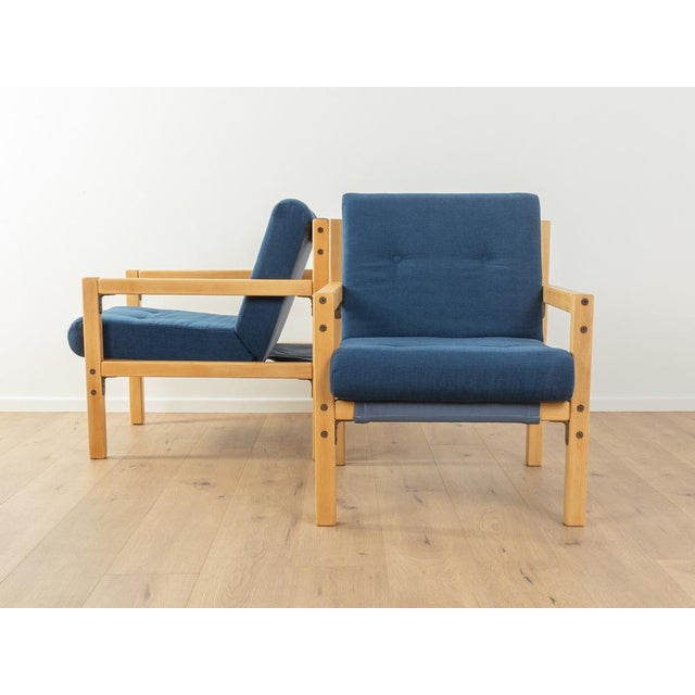 Rare armchairs from the 1970s by Flötotto. High-quality frame made of solid beech. The armchairs have been reupholstered...
