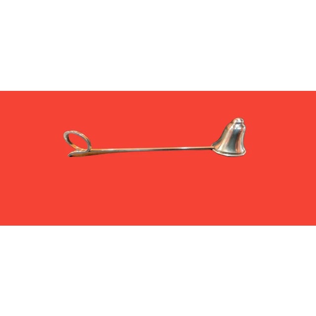 This listing is for a lovely vintage arts and crafts style Randahl Sterling Silver bell shaped candle snuffer. It has a...
