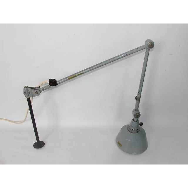 Midgard lamp, 1950s It is preserved in original condition and requires an E27 bulb Dimensions: arm length with base 50cm...
