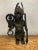 Circa late 18th century,Bronze metal male african warrior statue, the standing warrior is holding a sword and a rope