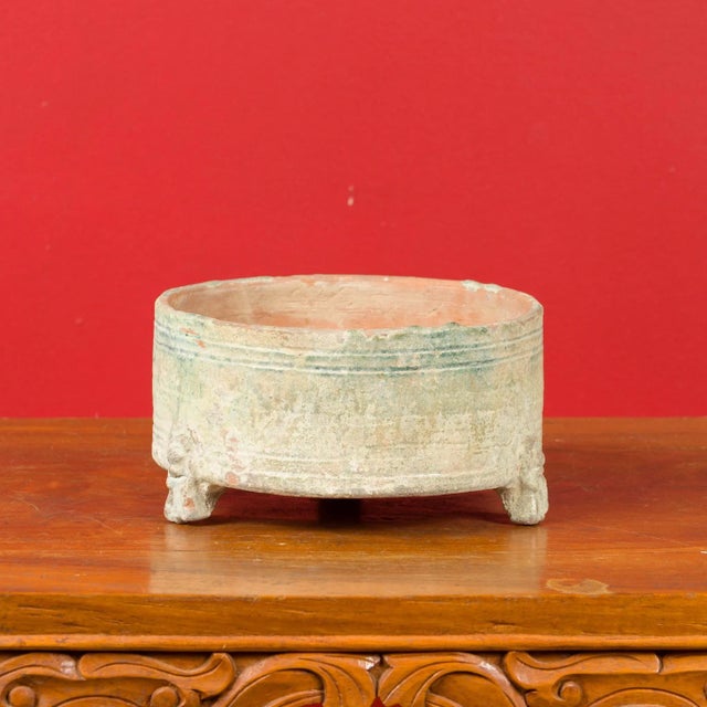 A Chinese Han dynasty incense burner circa 202 BC-200 AD, raised on petite feet. Crafted in China during the prestigious...