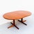 Rare and beautifully refinished expandable teak dining table on split pedestal base by Karl Erik Ekselius for J.O....