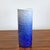 A beautiful HUTSCHENREUTHER color-gradient cylinder vase with a highly textured surface and a glossy finish of dark blue...