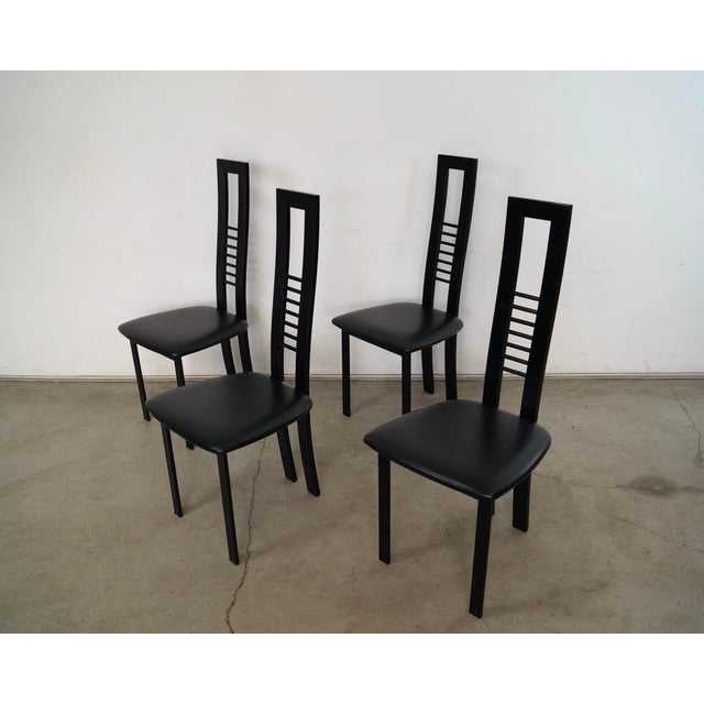 Set of four Post Modern dining chairs for sale. They are all in excellent condition, and have a great design to them. They...