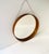A round brown teak wood wall mirror, Scandinavian Modern Swedish Modern period, by Glas Master, Markaryd, circa 1960s,...