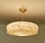 Large Art Deco pendant lamp featuring a flattened , stepped, vanilla light anber color mottled marble glass shade with...