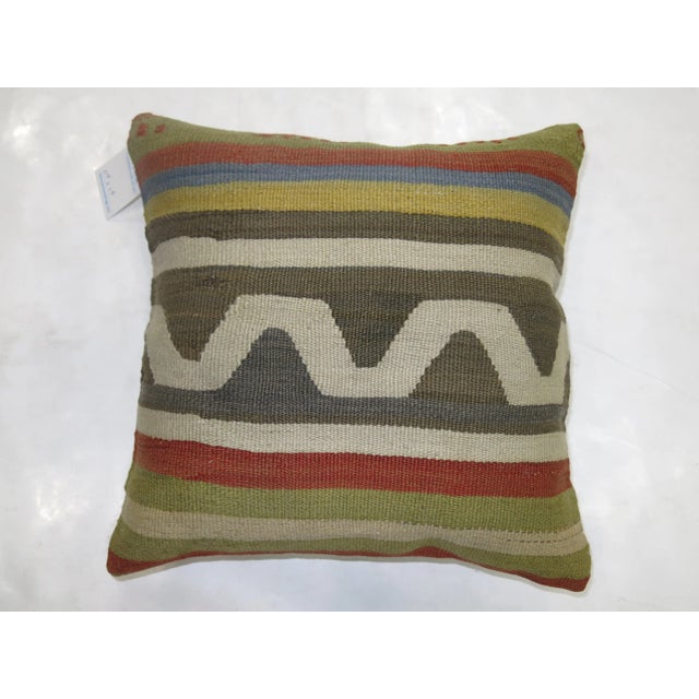 Pillow made from a vintage turkish kilim with cotton back. Zipper closure and foam insert provided. 16'' x 16''