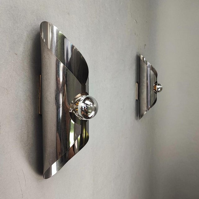 Pair of vintage 1960s Space Age tubular wall lights. Chromed steel structure. Fits a mirrored E27 bulb. Excellent vintage...