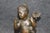 Elegant, romantic, and rich in classical symbolism, this exquisite French bronze putti sculpture is a captivating work of...