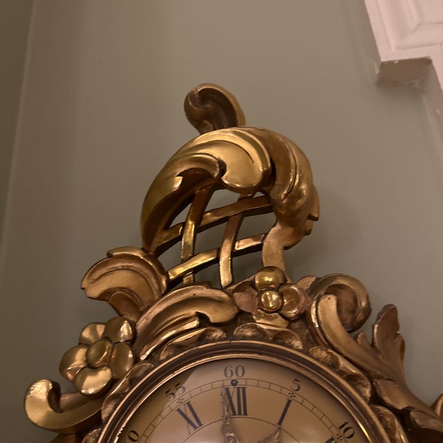 Antique carved guilt wood Swedish cartel wall hanging Clock with Roman numerals and ornate foliate brass hands , Bell...