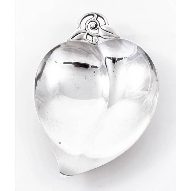 A set of three Tiffany & Co apple design candy dishes. Drawing on nature and natural form, these apple dishes pay homage...