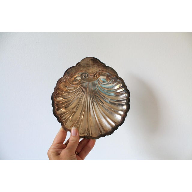 Vintage silver-plated scallop shell trinket dish. Makers stamp on back. Some tarnishing.