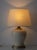 Elegant pair of French classic urn or ginger jar shaped table lamps in a warm cream craquelure glaze with subtle gold...