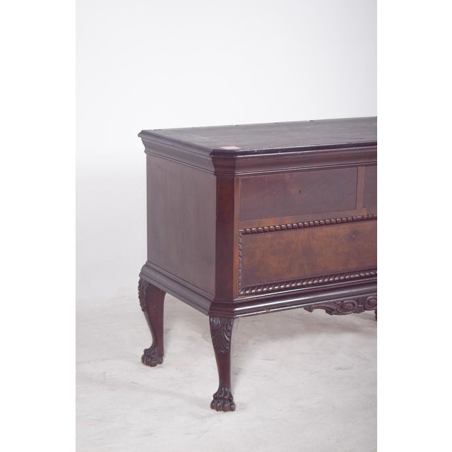 Half chest of drawers with two drawers and a large chest of drawers. In dark wood, it's a refined piece, strongly inspired...