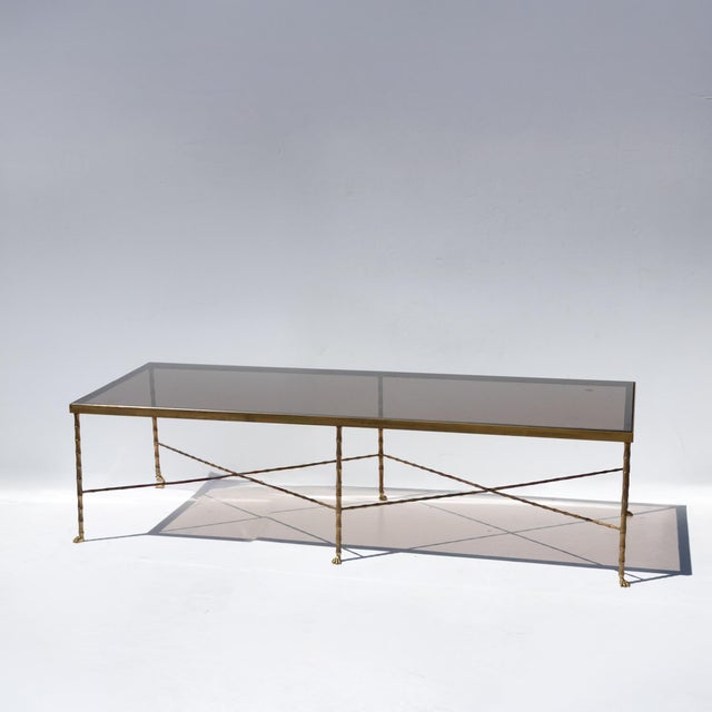 French Art Deco brass and mirror coffee table, attributed to Maison Baguès, Paris, circa 1920. Rectangular smoked mirror...