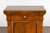 A pair of Italian walnut bedside cabinets from circa 1800 with single drawer and single door, carved giltwood twisted rope...