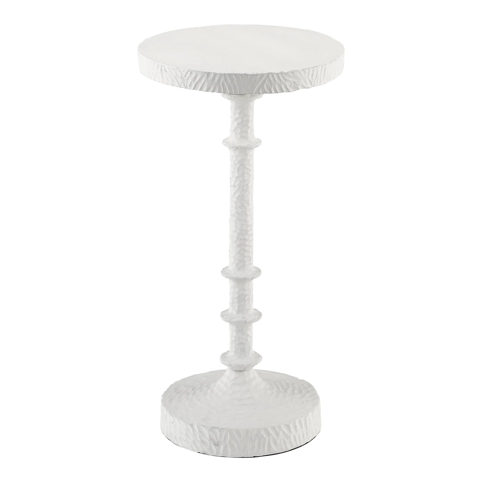 Round white pedestal table with textured surface