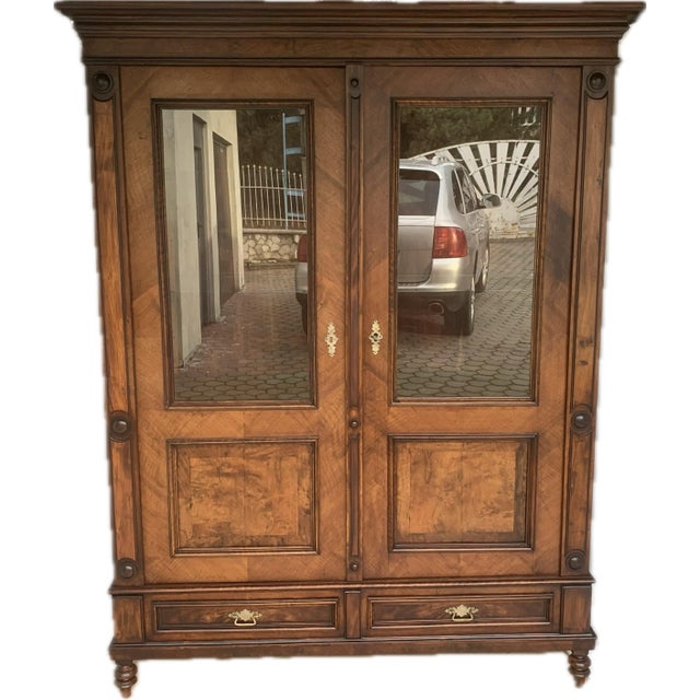 A sideboard for a living room or library from the 19th century. It is made entirely of wood covered with natural walnut...