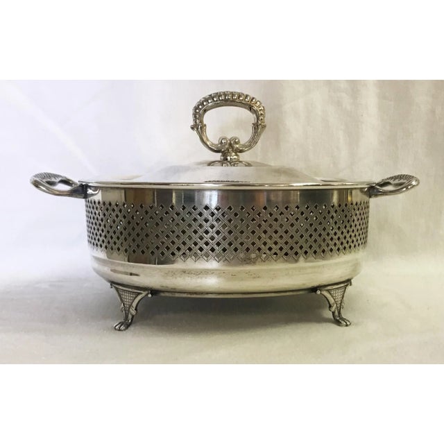 Classic casserole dish with lid. This round serving dish and lid are made of silverplate, and stamped 'Italy' on the...