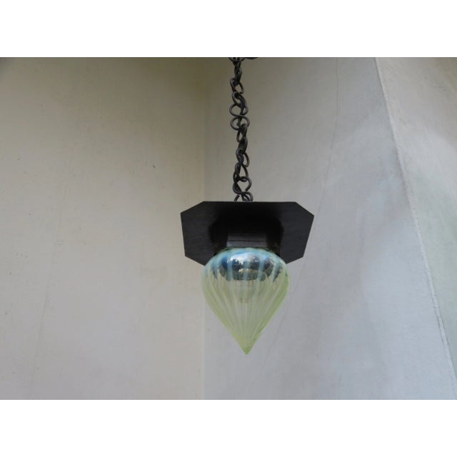 A delicate ceiling lamp from the time of art nouveau, hand-forged gear, iridescent opaline glass iridescent colorless...