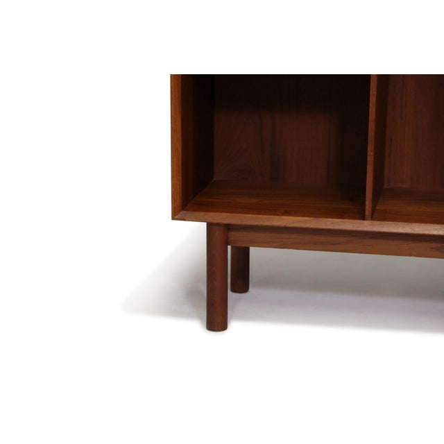 Danish Modern bookcase designed by Peter Hvidt, for Soborg Mobekfabrik Denmark, 1952-56. Finely crafted of solid teak, the...