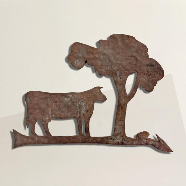 Cut from sheet steel and weathered to a deep, honest rust, this 20th century American folk art silhouette carries the...