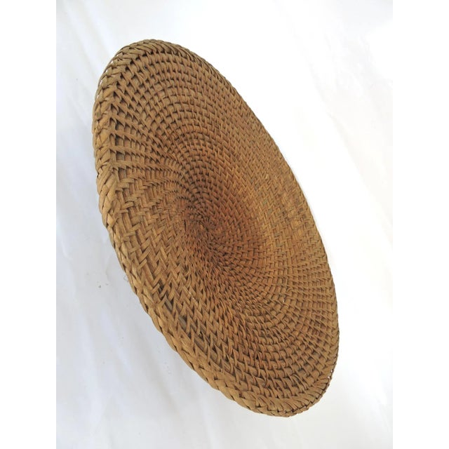 Gorgeous work - a totally hand woven "Hapao Saucer" basket/tray made from split rattan with a spiral 'twisted' rattan...