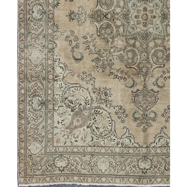 Keivan Woven Arts, H-1211-36, Vintage Tabriz Rug - 10′ × 12′6″. Mid-century hand-knotted Persian Tabriz carpet with a...