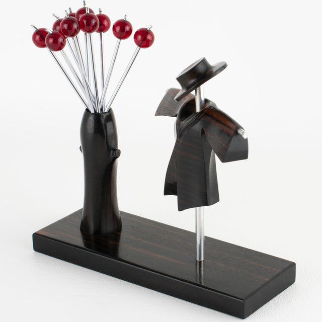This stunning barware set, featuring a cocktail picks set, was crafted in France circa 1930. The bar set features a...