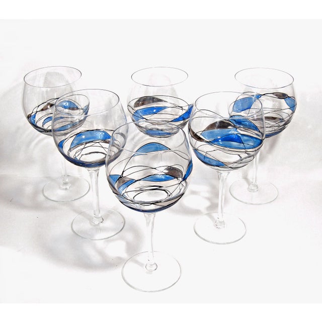 Elevate your table with this set of 6 stunning mosaic stained glass wine glasses. Each glass is hand-painted with flowing...