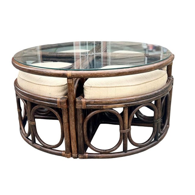 Unusual vintage four-piece rattan nesting seating and cocktail table ensemble by Alexvale Furniture, Inc. of Taylorsville,...