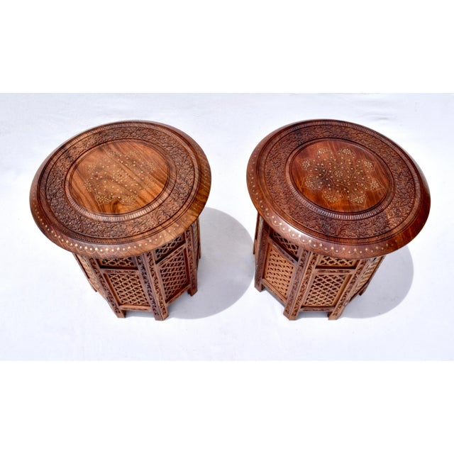 A versatile, standout pair of 1950's Anglo Indian stands, stools or tables, hand crafted in teak wood having round tops...