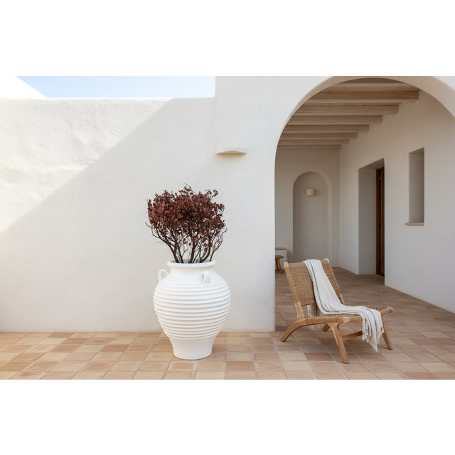 This impressive vessel is a contemporary reimagining of the ancient Greek Amphora or storage jar. Standing nearly 2.5 feet...