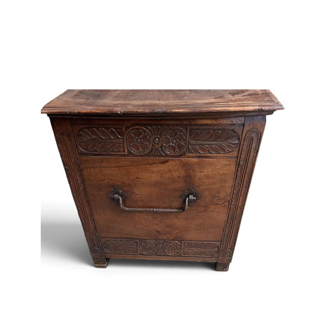 The cassone is most probably of Florence origin and retains its original lid and wrought iron carrying handles. Corner of...