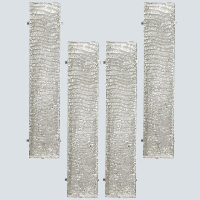 Clean lines to complement all decors. Wonderful high-end and huge wall light fixtures with thick textured glass from...