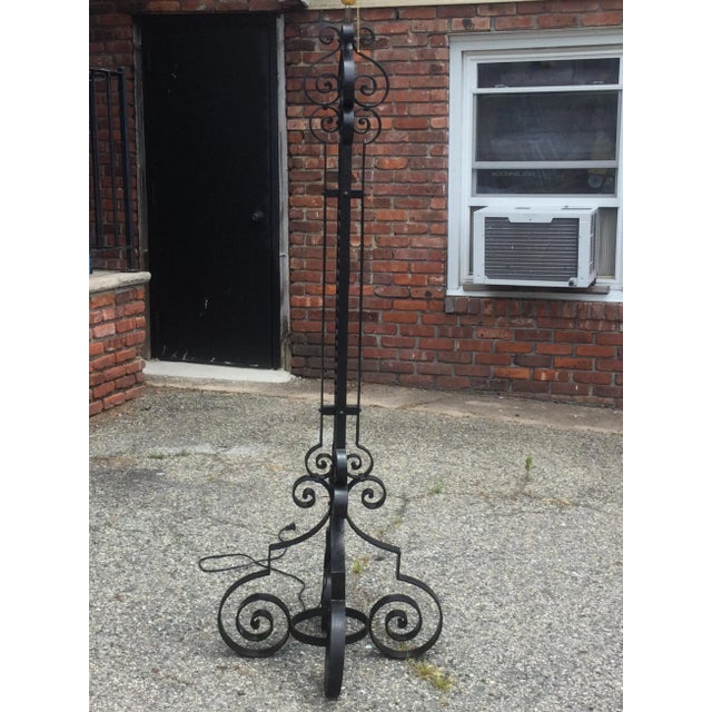 Fabulous French wrought iron floor lamp. In the style of Spanish Mission, this floor lamp is elegant and highly practical....