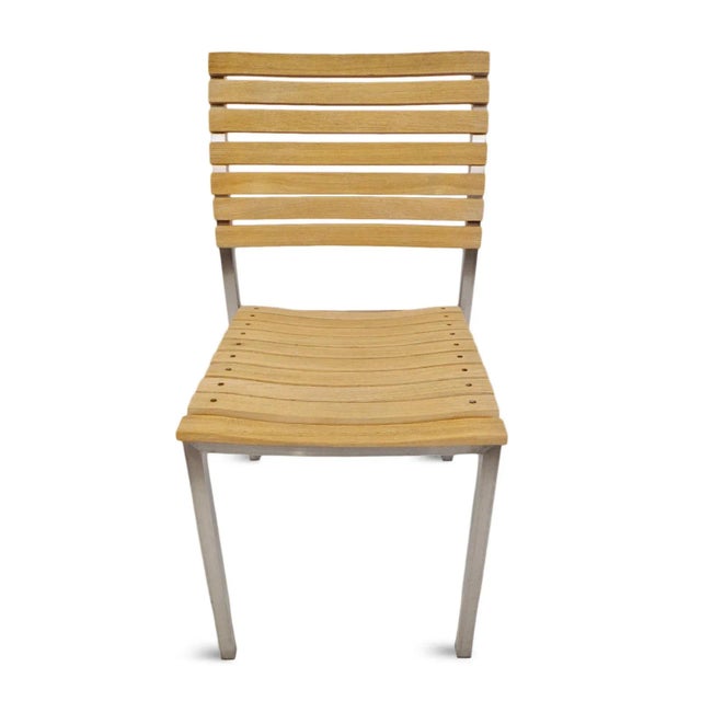 Classic simple slatted teak wood chair with chrome frame. Seat height is 18".
