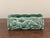 A stunning mid-century modern rectangular ceramic console planter featuring a highly stylized, embossed relief of a...