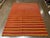 Handwoven Persian kilim flatweave rug featuring a simple striped field with alternating horizontal bands in warm tones....
