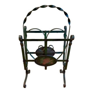Early Wrought Iron Magazine Rack With a Heart Shaped Design and Painted Floral Medallion For Sale