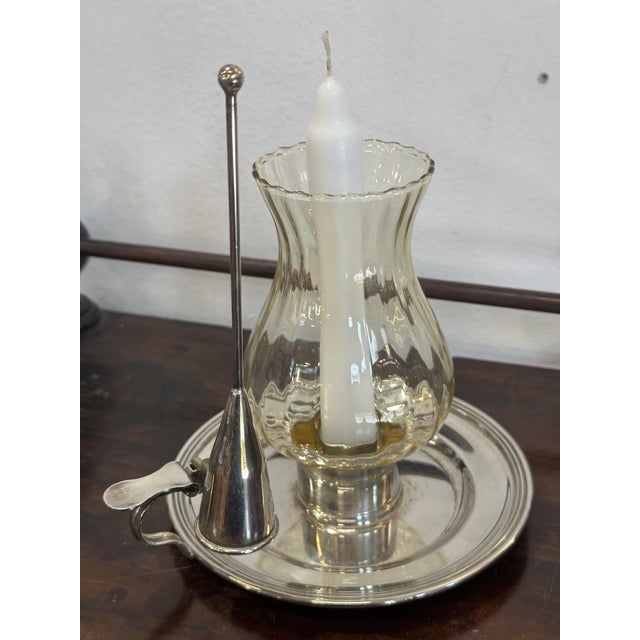 Candle holder - Chamberstick in 800 silver. The base is round with a cast handle. This handle serves two purposes: to...