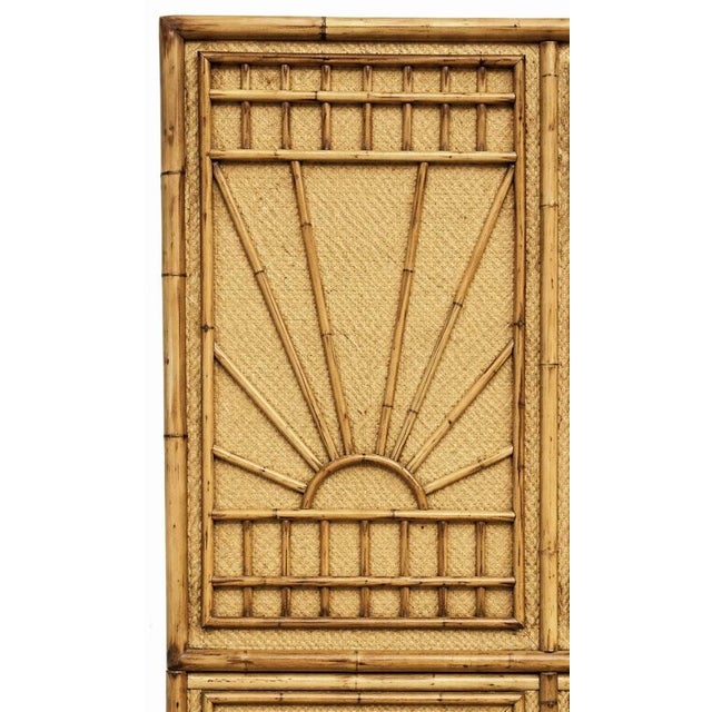 This is a Hollywood Regency Era tall bamboo cabinet with sunburst or rising sun panels. It opens to three shelves and had...