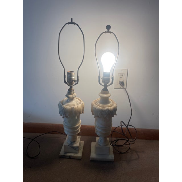 A pair of Vintage/Antique Carved Alabaster lamps. A traditional design that compliments varying design styles. Equally at...